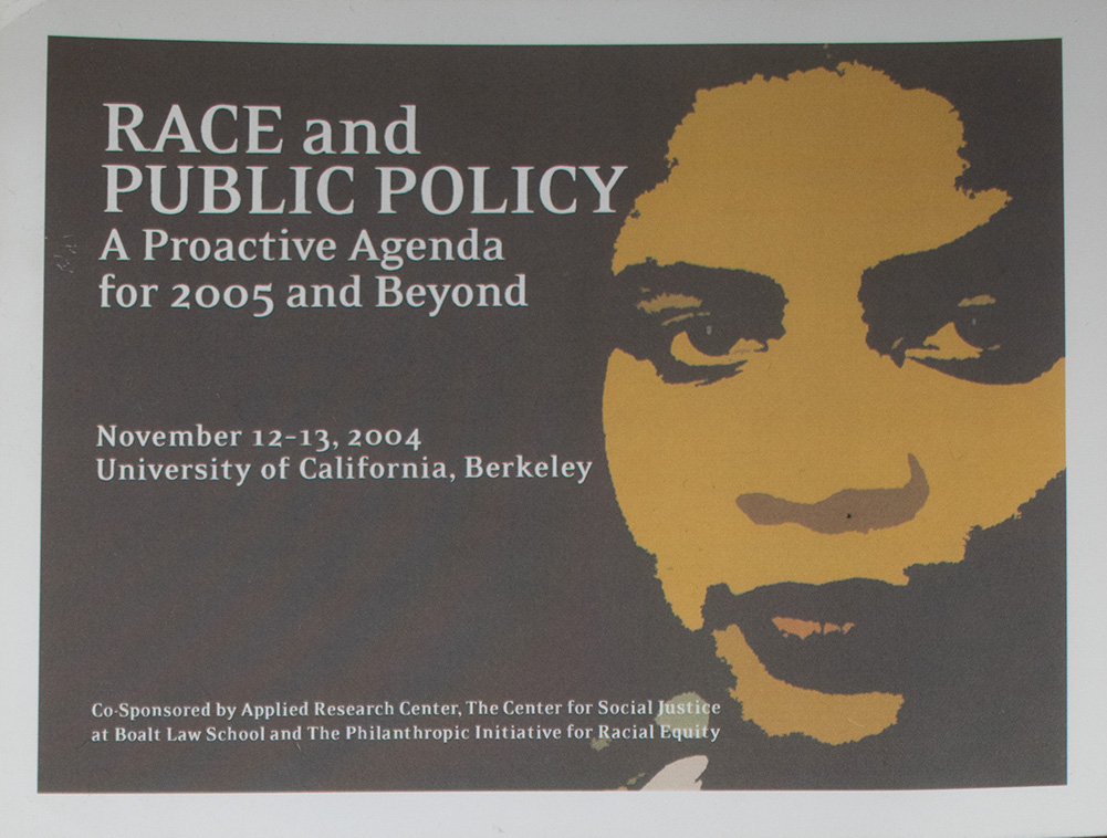 Quarter sheet for “Race and Public Policy: A Proactive Agenda for 2005 and Beyond” with a two-tone image of a face in brown and tan.