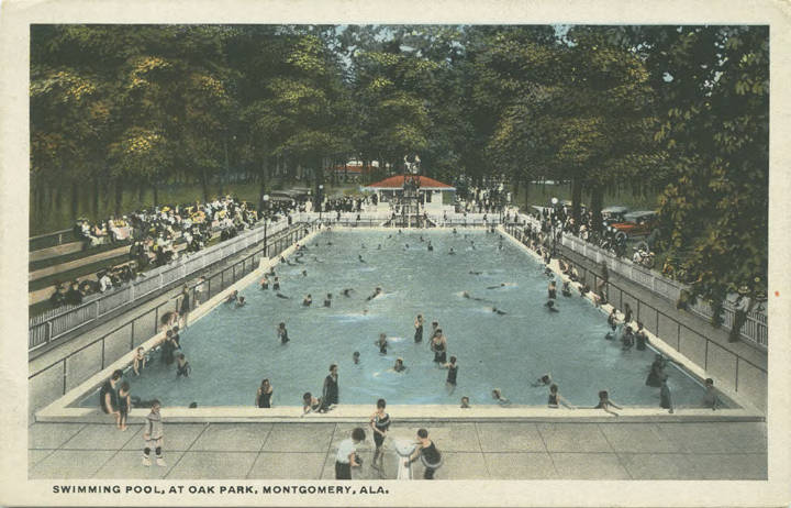 Large pool in use by many people. Caption: Swimming pool, at Oak Park, Montgomery, Ala.